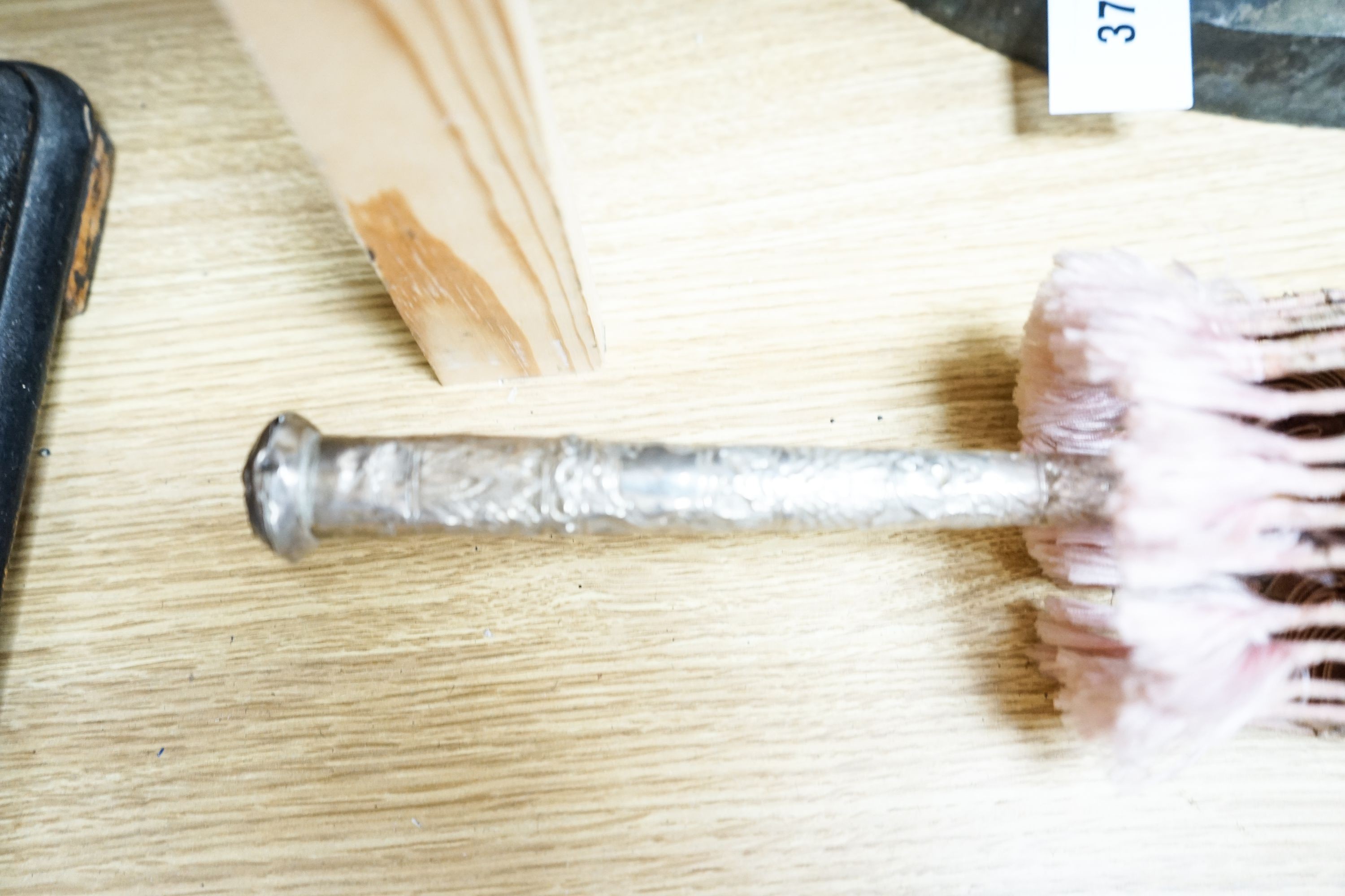 A 19th century Chinese Canton export ivory parasol with carved Ivory handle and a Burmese white metal handled painted fabric parasol